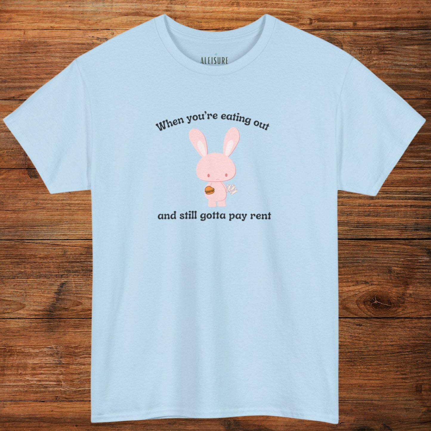 light blue gildan 5000 t-shirt, when you're eating out and still gotta pay rent text, pink bunny with hamburger and bills image