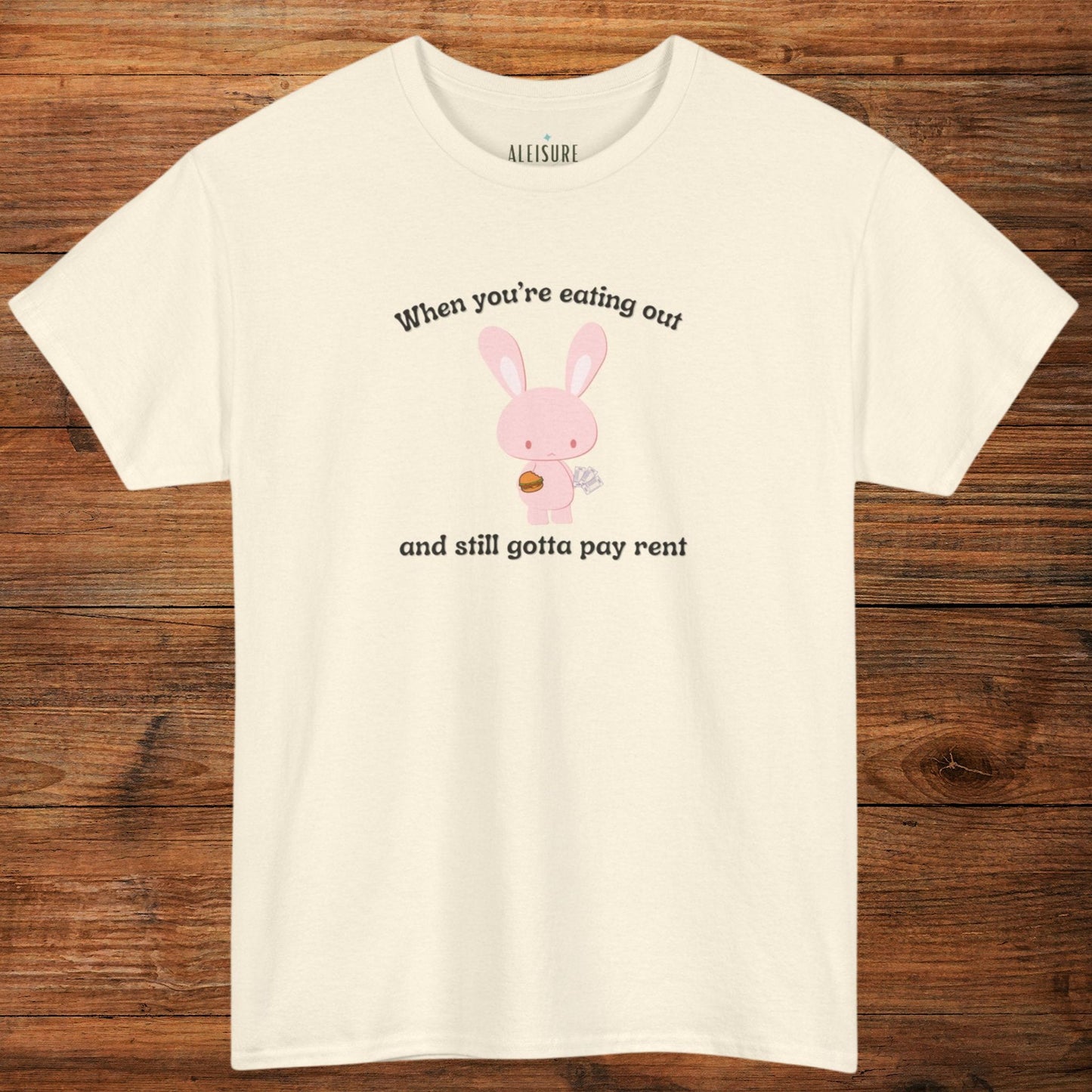 natural-colored gildan 5000 t-shirt, when you're eating out and still gotta pay rent text, pink bunny with hamburger and bills image